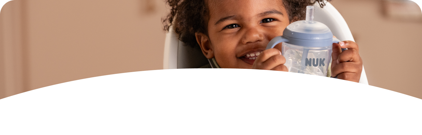 [Translate to Polish (Reborn) nuk.pl:] Baby with Learner Straw