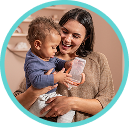 [Translate to Polish (Reborn) nuk.pl:] Mother with Baby and Learner Bottle