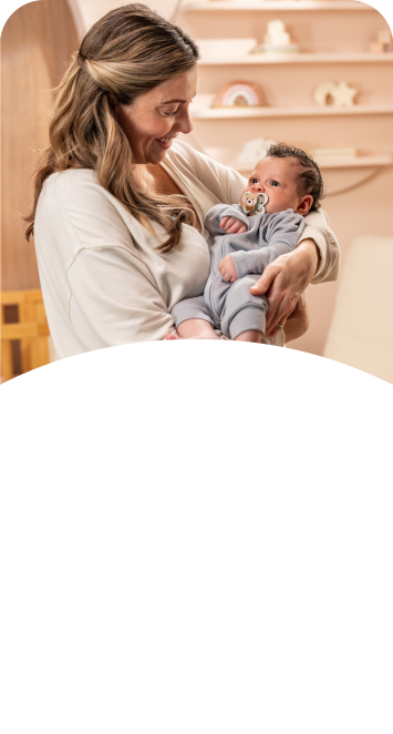 [Translate to Polish (Reborn) nuk.pl:] Mother with baby and soother