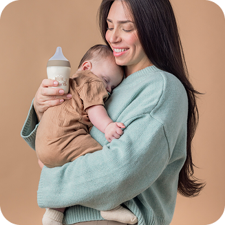 [Translate to Polish (Reborn):] Mother with Baby and Baby bottle
