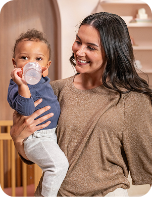[Translate to Polish (Reborn):] Mother with Baby and Learner bottle